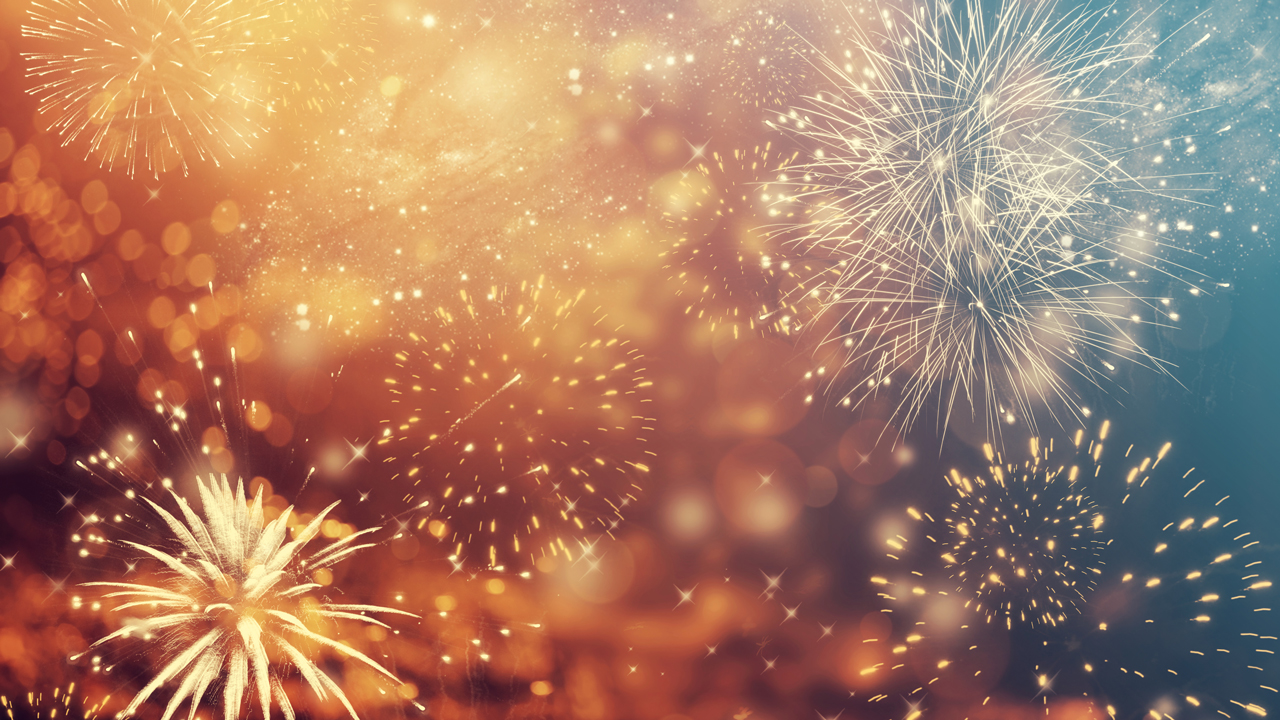 Golden colored fireworks in sky.